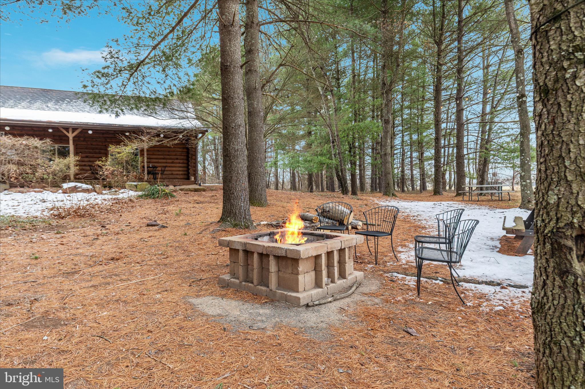 43301 Spinks Ferry Road Leesburg, VA 20176 - Photo 34 of 102 a view of a patio with a table and chairs