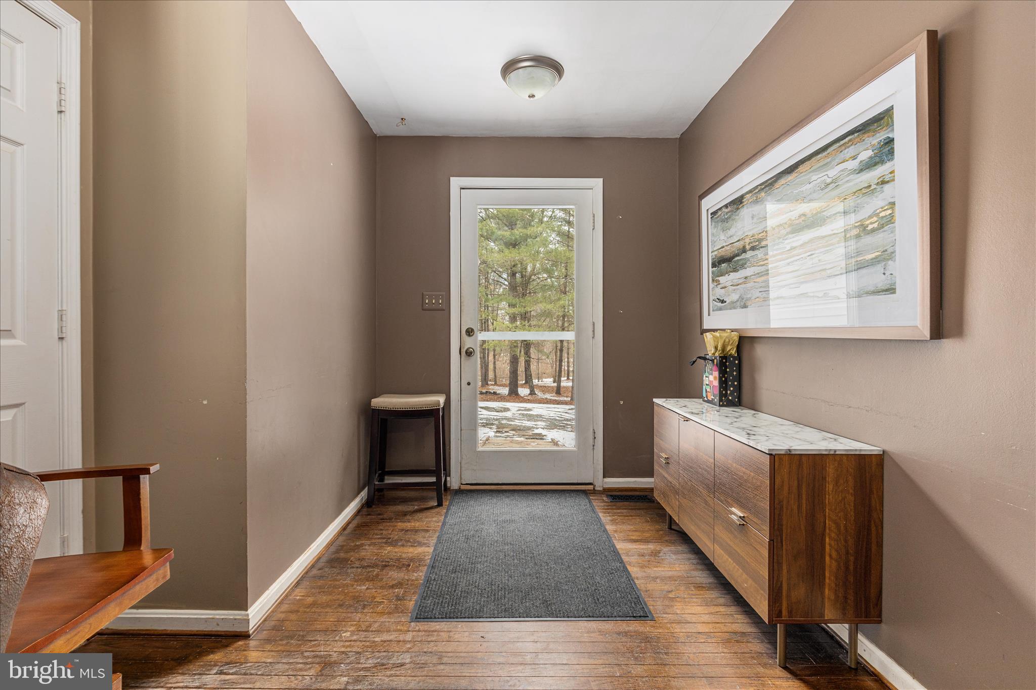 43301 Spinks Ferry Road Leesburg, VA 20176 - Photo 41 of 102 a view of hallway with furniture and a window