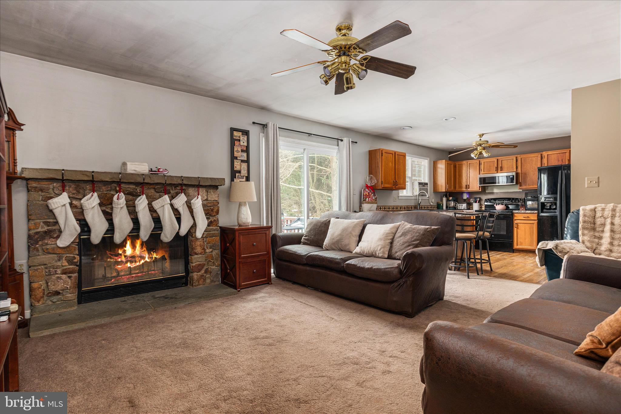 43301 Spinks Ferry Road Leesburg, VA 20176 - Photo 49 of 102 a living room with furniture and a flat screen tv