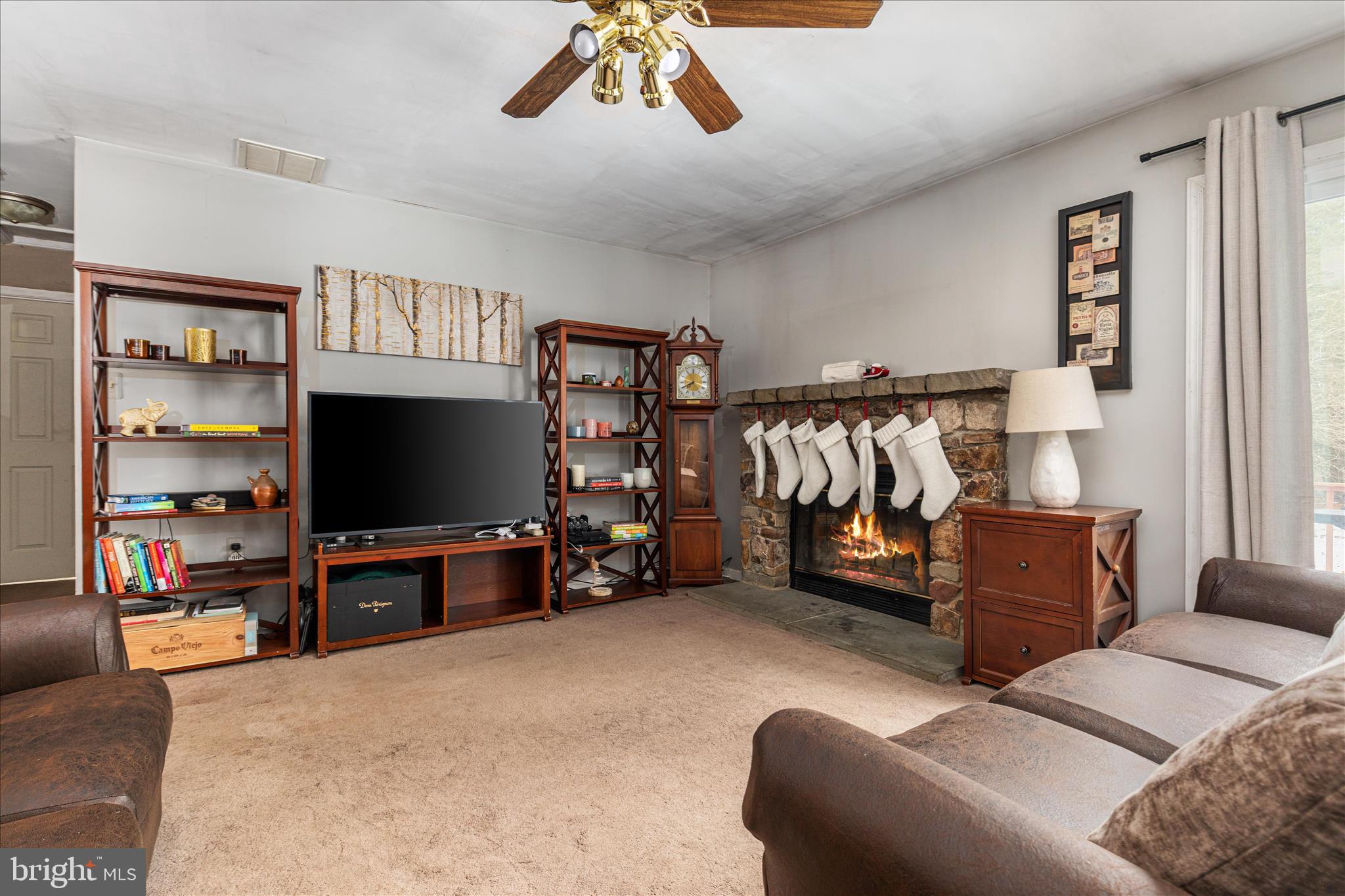 43301 Spinks Ferry Road Leesburg, VA 20176 - Photo 51 of 102 a living room with furniture and a flat screen tv