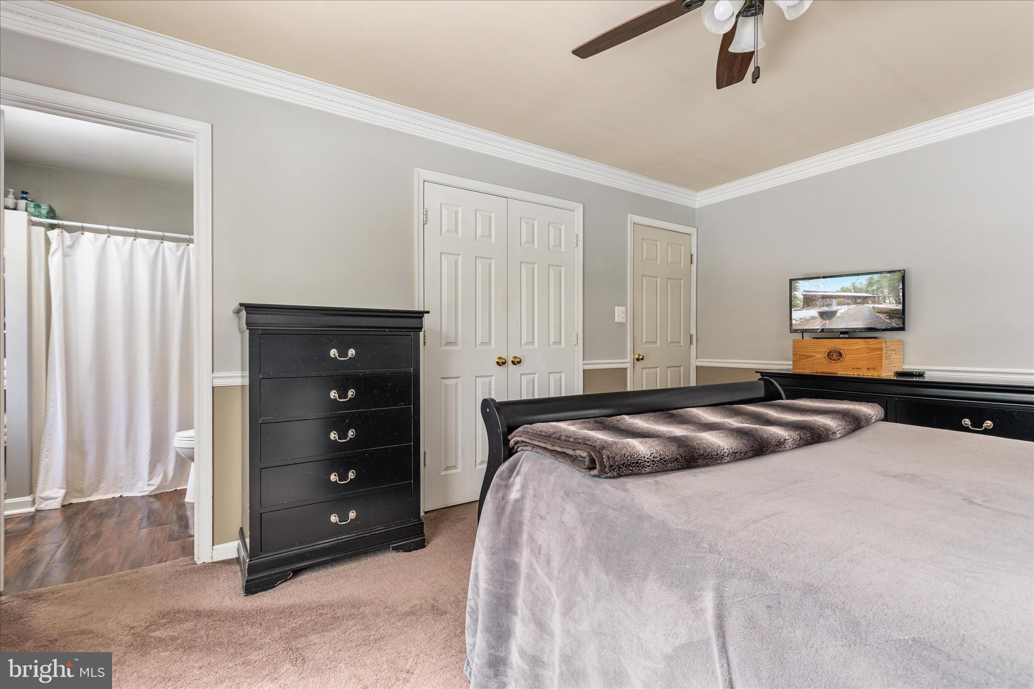 43301 Spinks Ferry Road Leesburg, VA 20176 - Photo 58 of 102 a bedroom with a bed and a dresser