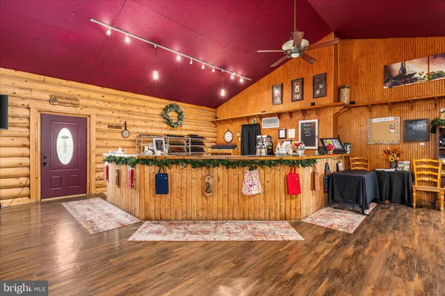 a kitchen with stainless steel appliances kitchen island granite countertop a sink and cabinets