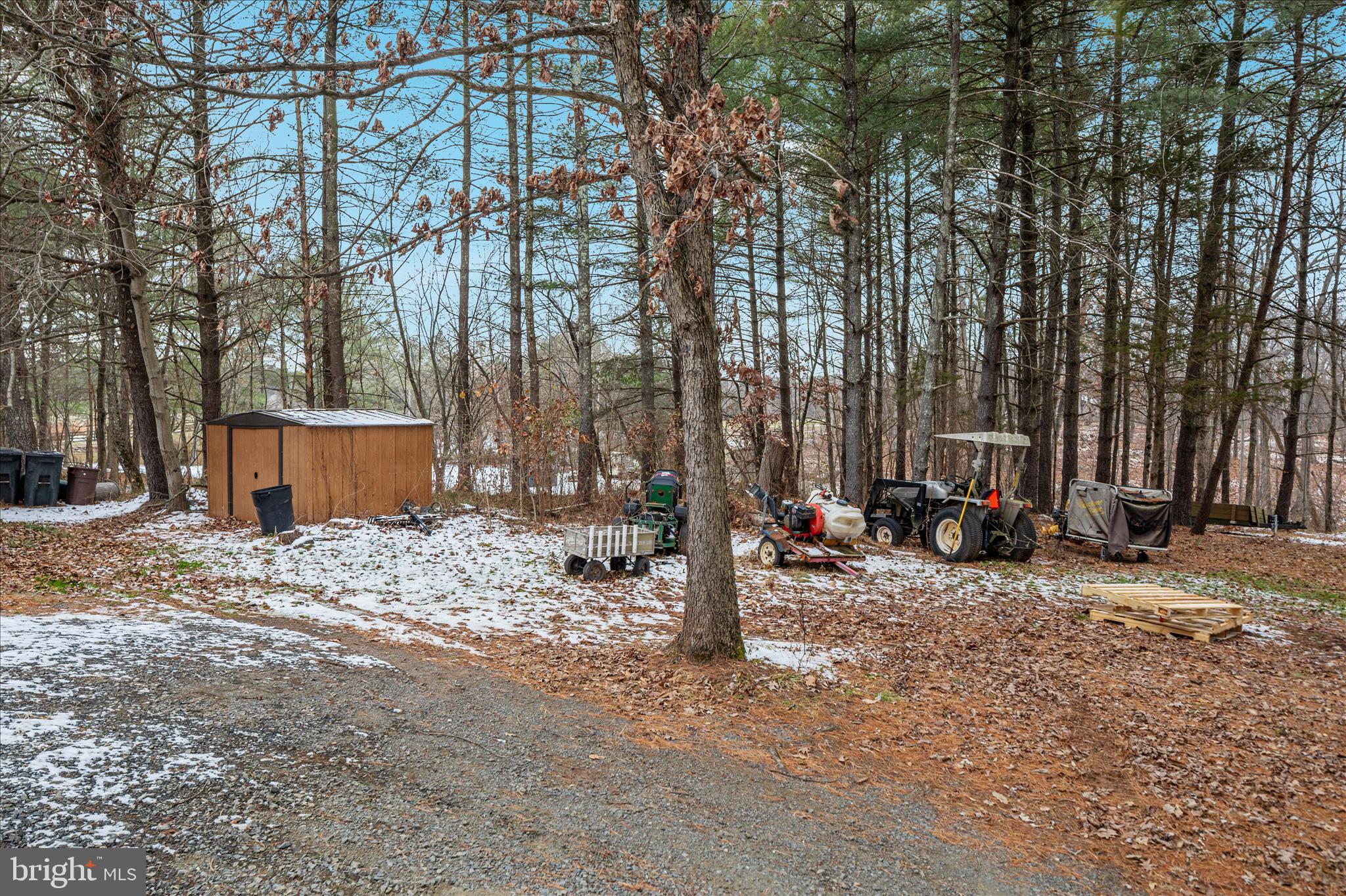 43301 Spinks Ferry Road Leesburg, VA 20176 - Photo 79 of 102 a view of a backyard with large trees and wooden fence