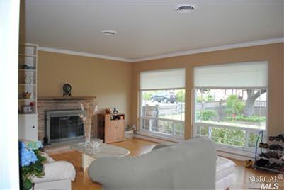 2133 Center Road Novato, CA 94947 - Photo 1 of 1 a living room with furniture and a fireplace