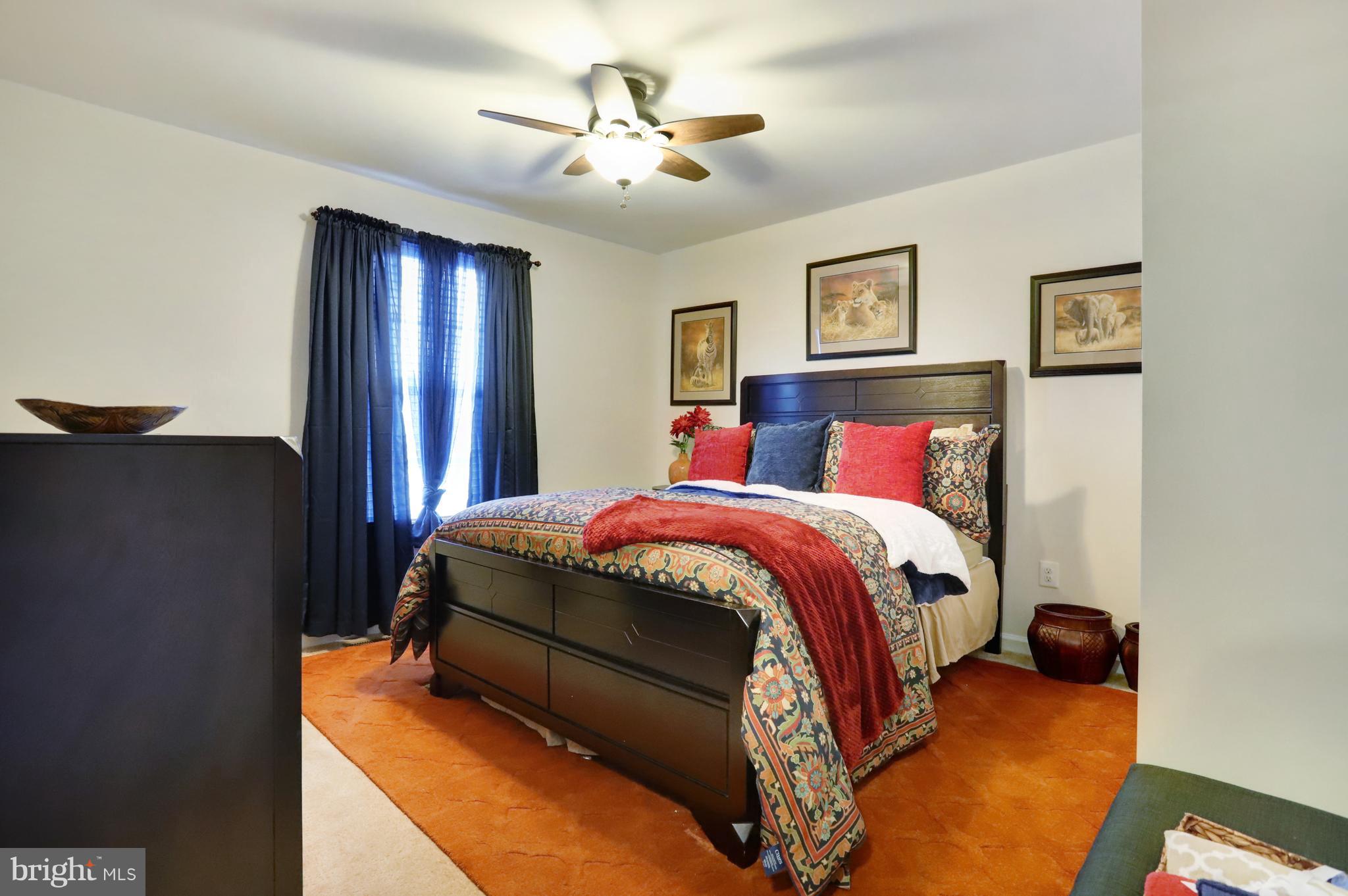 164 Mountain Laurel Boulevard Ranson, WV 25438 - Photo 22 of 51 Bedroom 1 w/carpet flooring and ceiling fan
