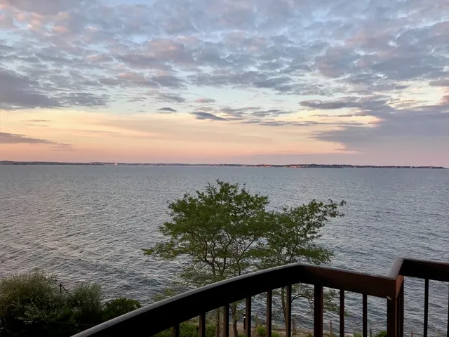 a view of a lake from a balcony