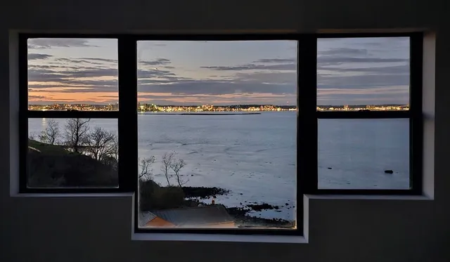 a kitchen with granite countertop a stove and a refrigerator