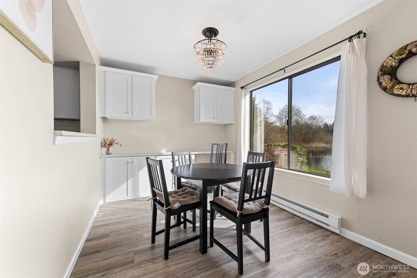 1002 South 312th Street, Unit 114 Federal Way, WA 98003 - Photo 11 of 39 a view of a dining room with furniture window and outside view