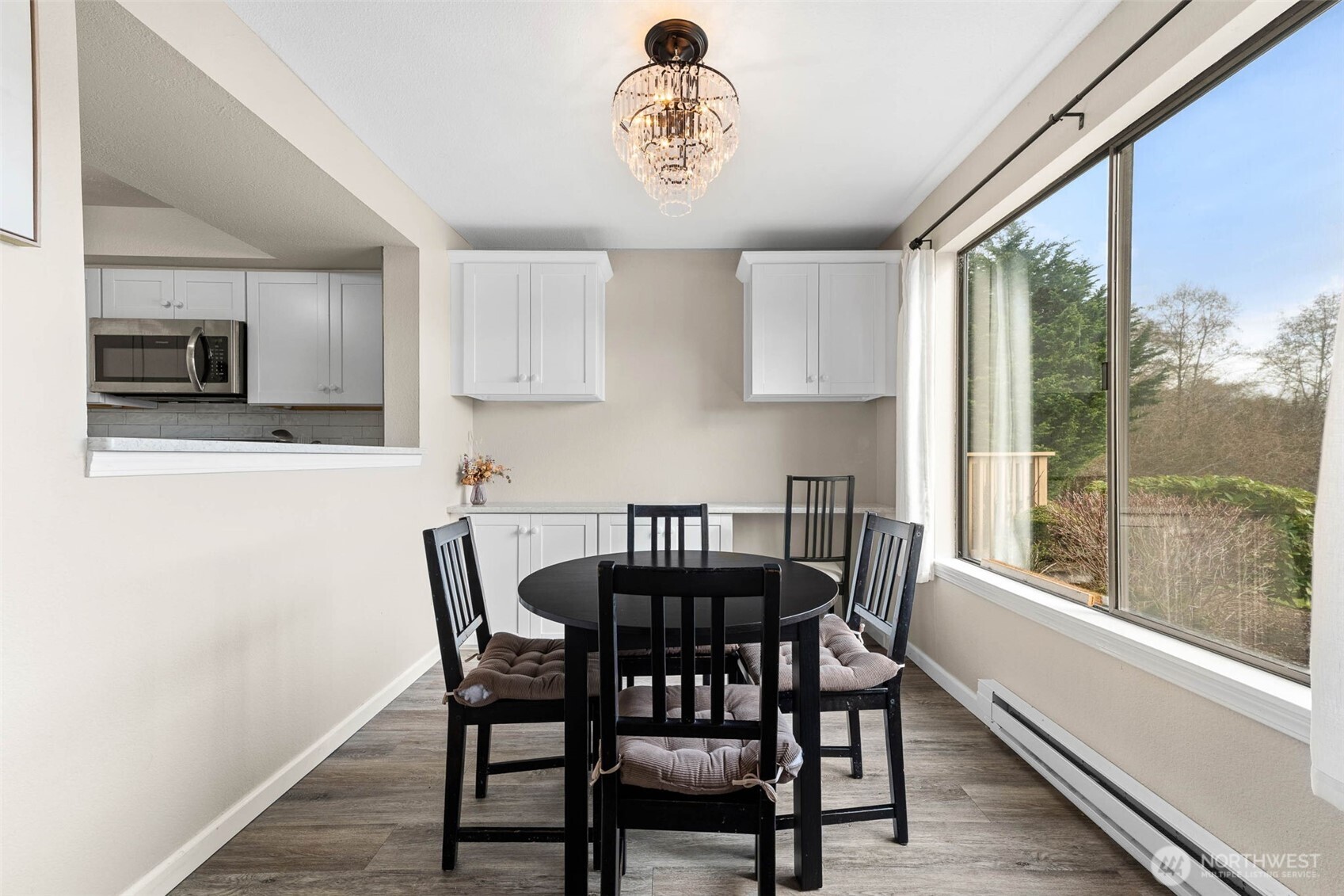 1002 South 312th Street, Unit 114 Federal Way, WA 98003 - Photo 12 of 39 a view of a dining room with furniture window and outside view