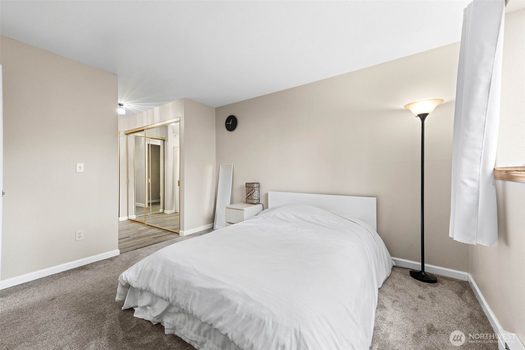 1002 South 312th Street, Unit 114 Federal Way, WA 98003 - Photo 14 of 39 a bedroom with a bed and a mirror