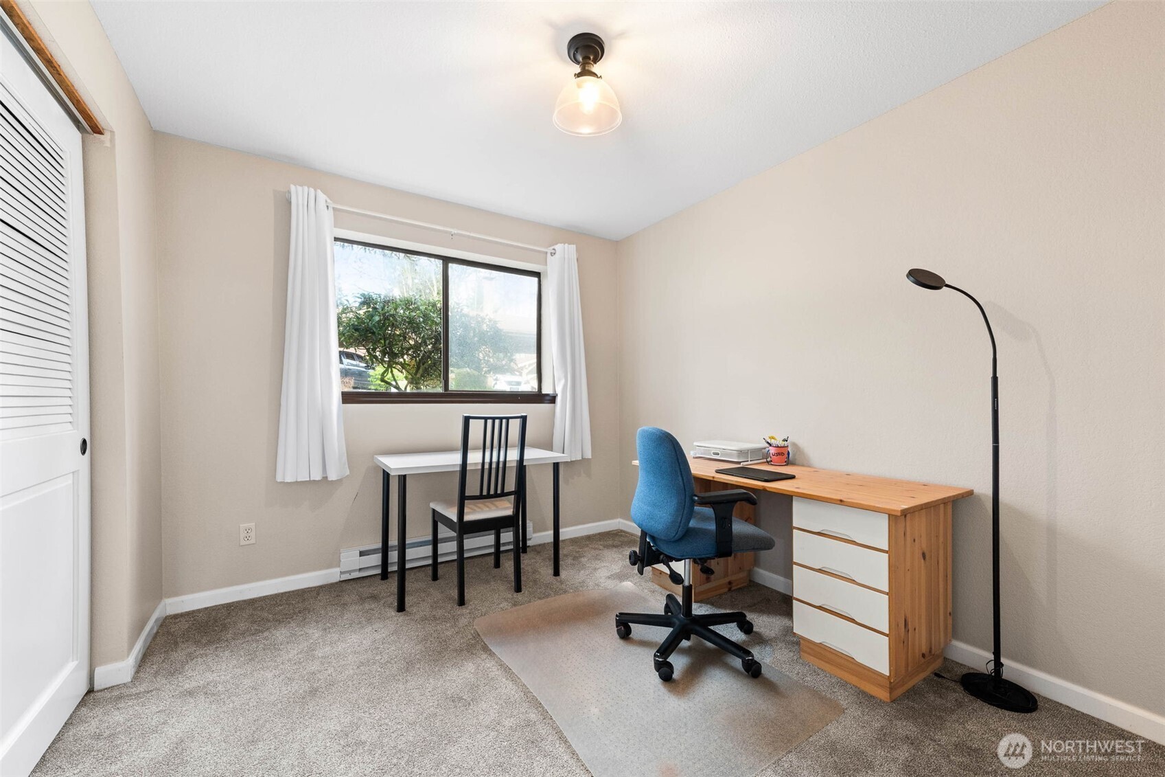 1002 South 312th Street, Unit 114 Federal Way, WA 98003 - Photo 17 of 39 a view of a workspace with furniture and a window