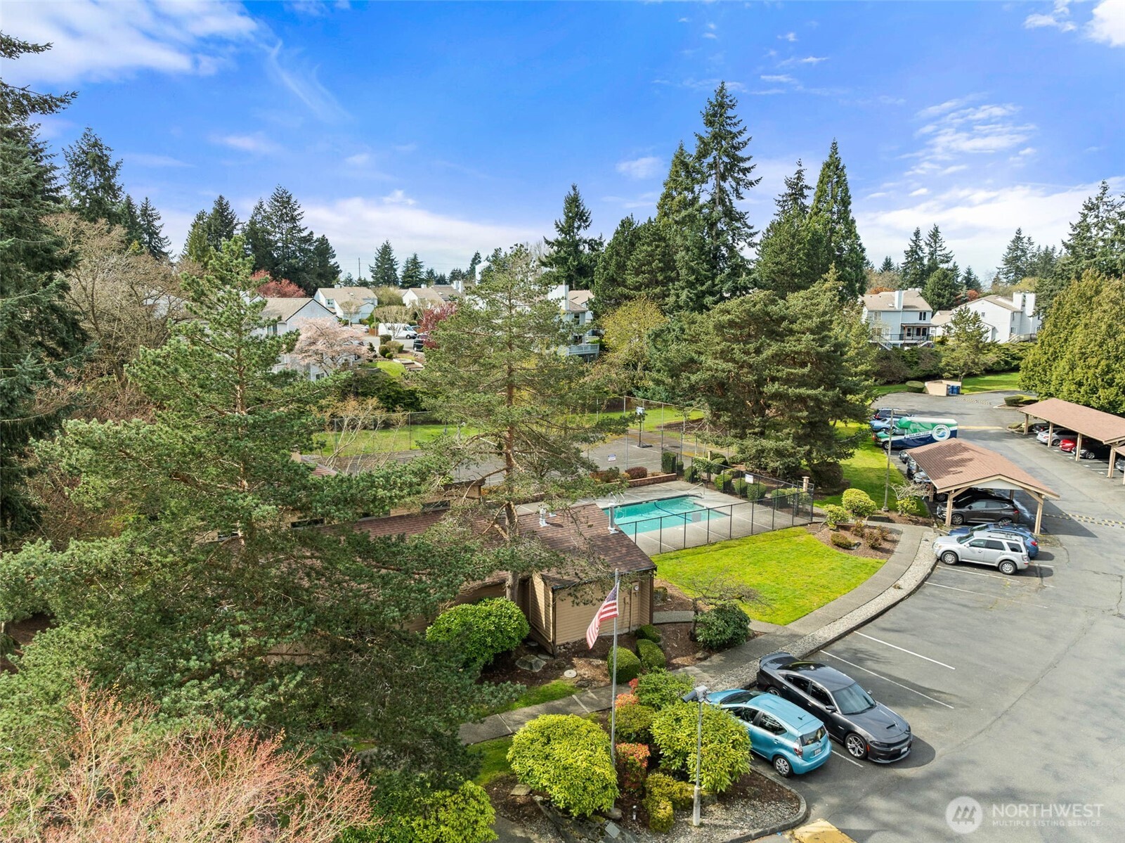1002 South 312th Street, Unit 114 Federal Way, WA 98003 - Photo 26 of 39 a view of a swimming pool with a yard