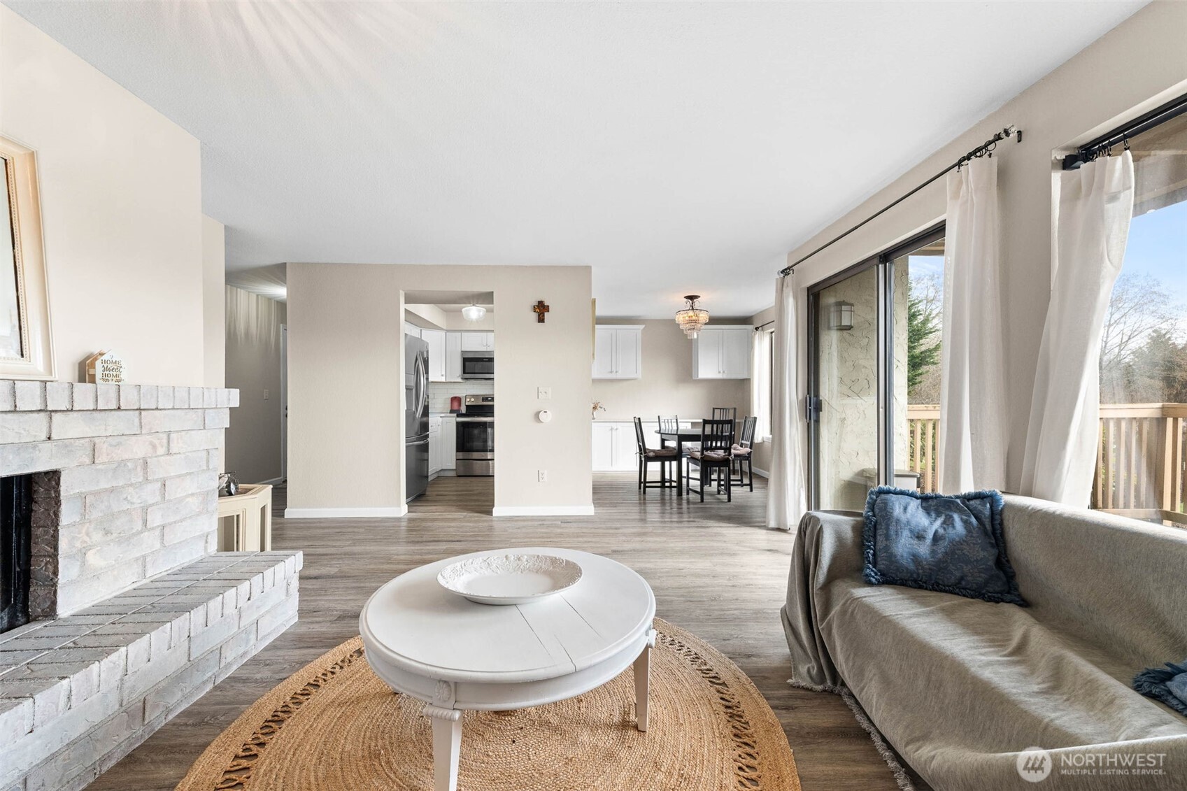 1002 South 312th Street, Unit 114 Federal Way, WA 98003 - Photo 3 of 39 a living room with furniture and a large window