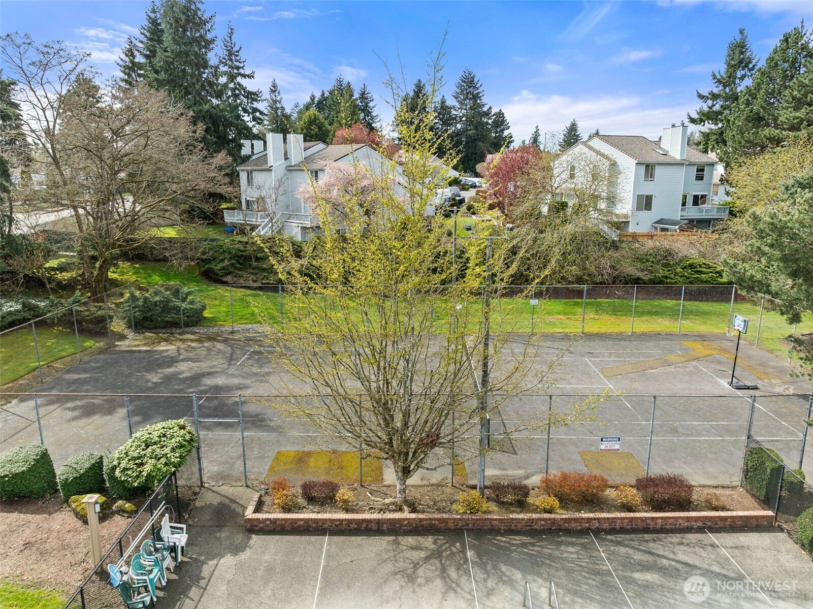 1002 South 312th Street, Unit 114 Federal Way, WA 98003 - Photo 31 of 39 a view of a swimming pool with a yard