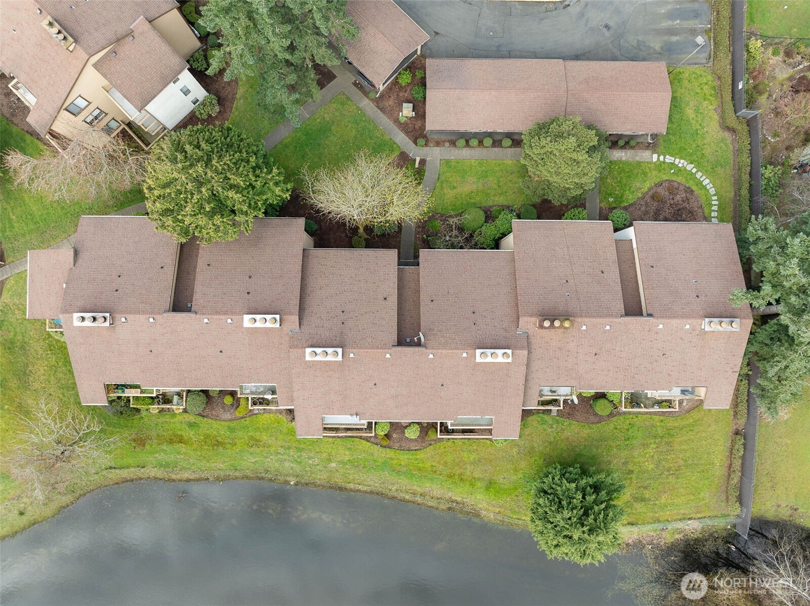 1002 South 312th Street, Unit 114 Federal Way, WA 98003 - Photo 33 of 39 an aerial view of a house with a garden and a yard