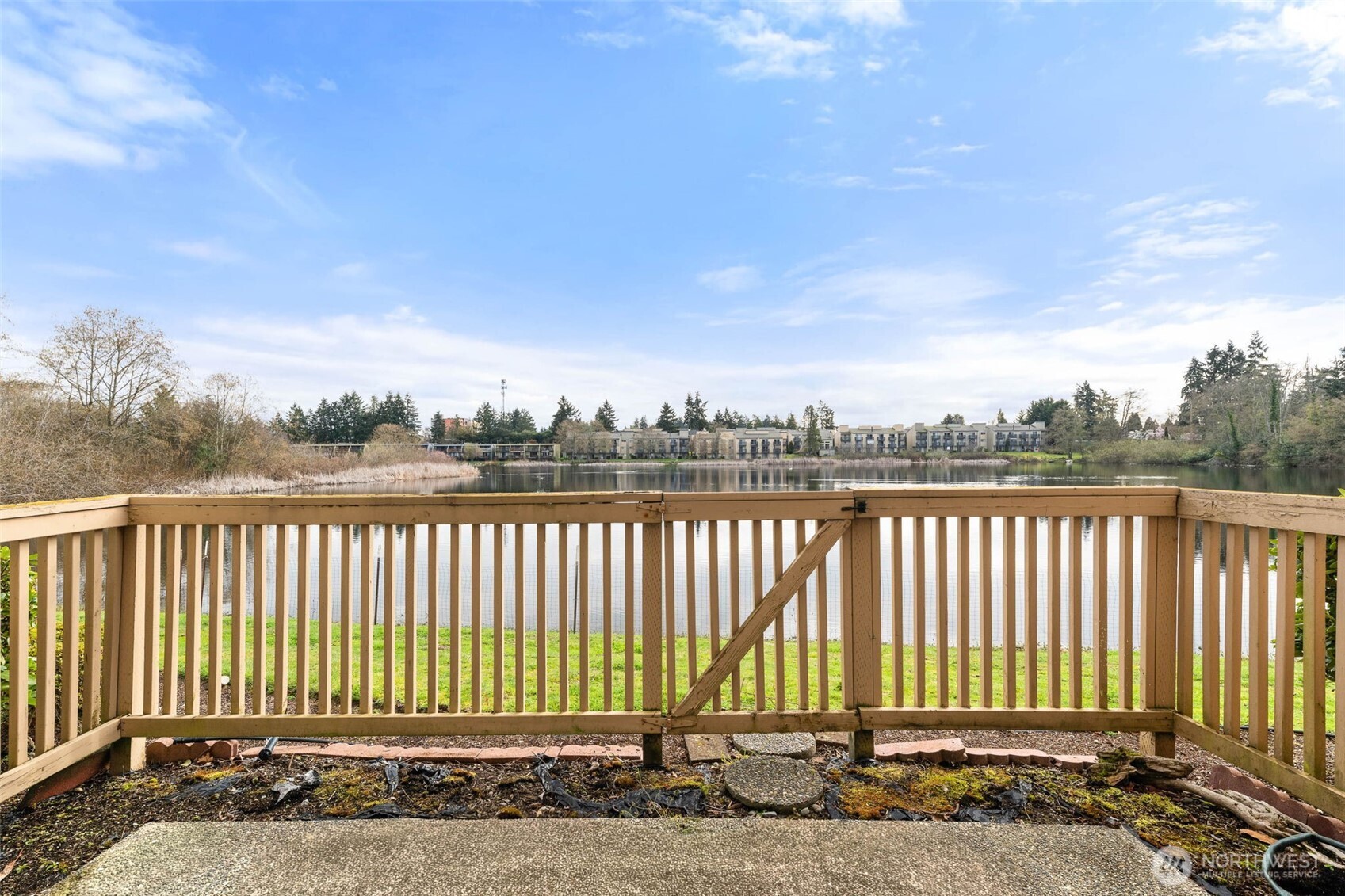 1002 South 312th Street, Unit 114 Federal Way, WA 98003 - Photo 6 of 39 a view of a brick house with a small yard