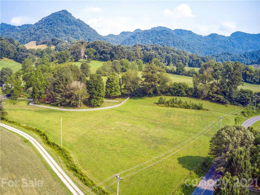 120 Arrowood Acres Road Clyde, NC 28721 - Photo 12 of 42 a view of a field with mountains in the background