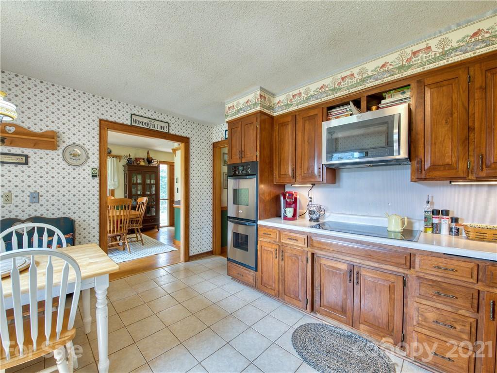 120 Arrowood Acres Road Clyde, NC 28721 - Photo 20 of 42 a kitchen with sink cabinets and window