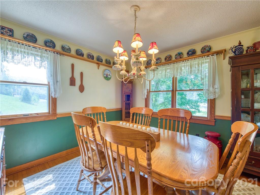 120 Arrowood Acres Road Clyde, NC 28721 - Photo 24 of 42 a view of a dining room with furniture window and outside view