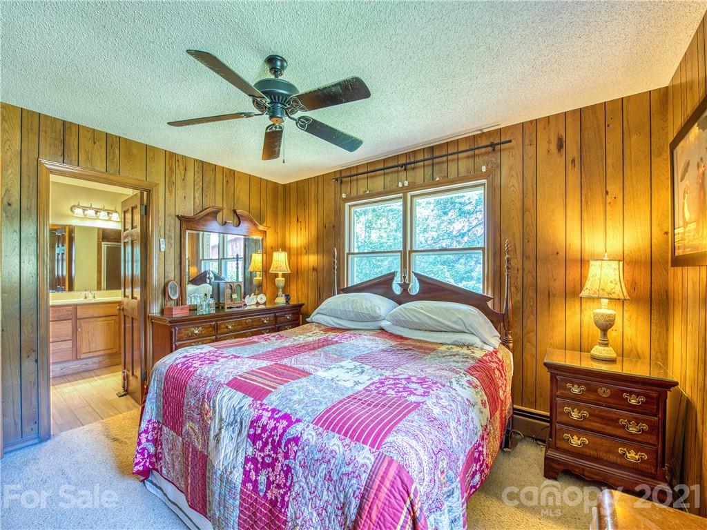 120 Arrowood Acres Road Clyde, NC 28721 - Photo 28 of 42 a bedroom with a bed and window