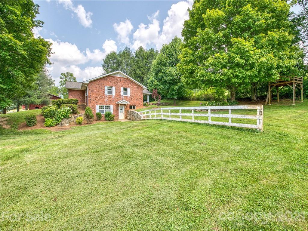 120 Arrowood Acres Road Clyde, NC 28721 - Photo 4 of 42 a view of a house with a big yard