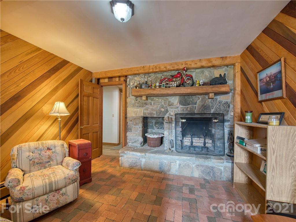 120 Arrowood Acres Road Clyde, NC 28721 - Photo 39 of 42 a living room with furniture and a fireplace
