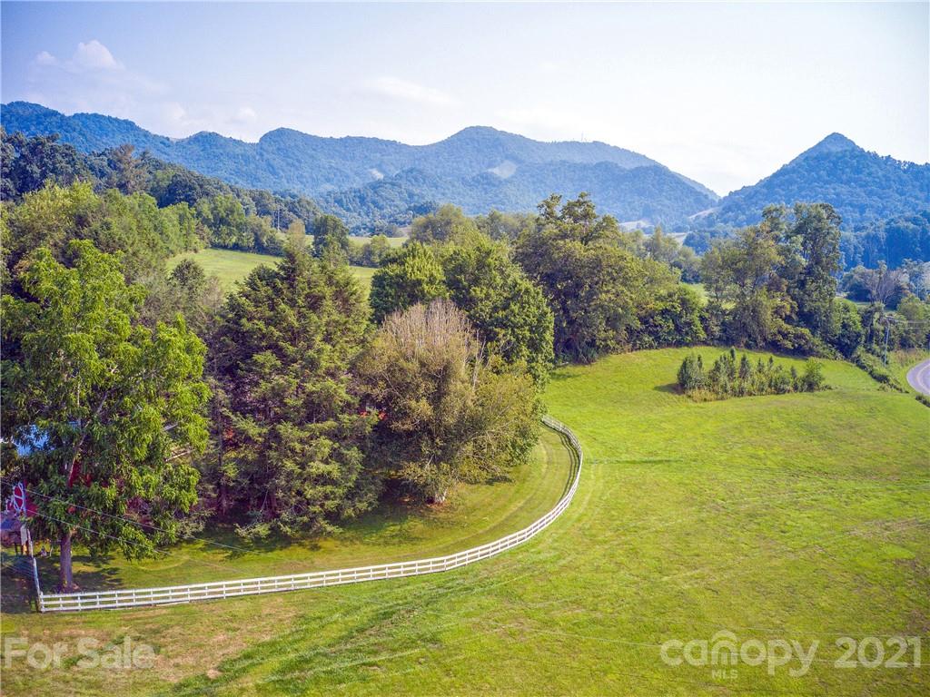 120 Arrowood Acres Road Clyde, NC 28721 - Photo 10 of 42 a view of a lake with a mountain in the background
