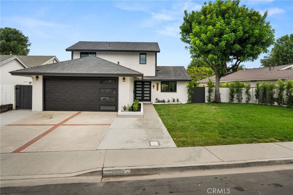 23981 Crescent Road Lake Forest, CA 92630 - Photo 1 of 1 a front view of a house with a yard and garage