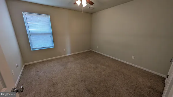 an empty room with a mirror