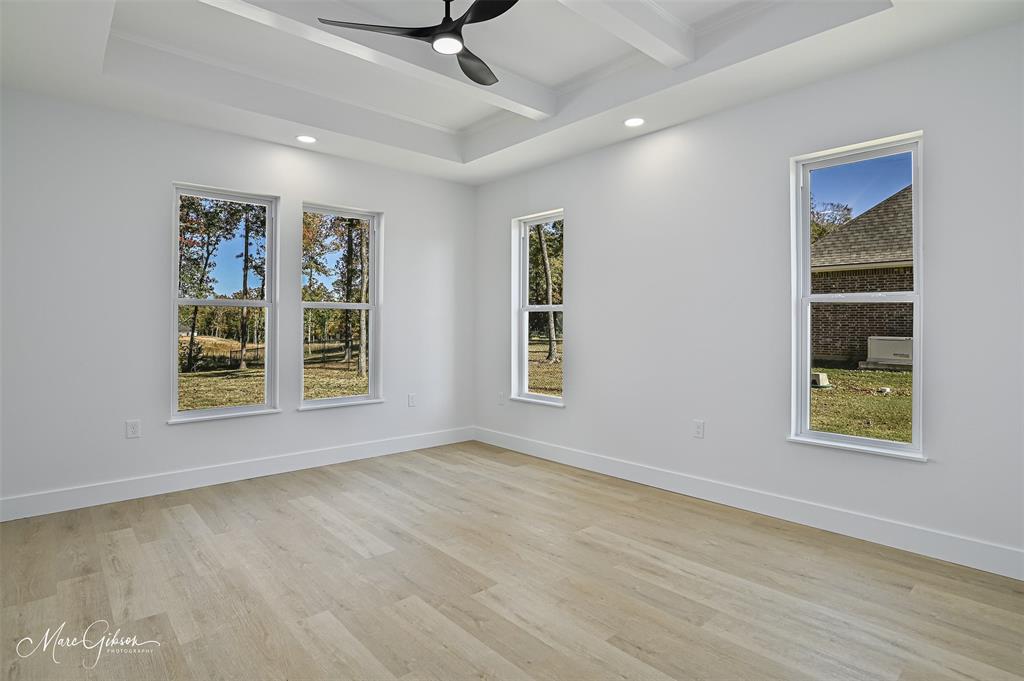 674 Rambin Road Stonewall, LA 71078 - Photo 13 of 26 a view of an empty room with a window and wooden floor