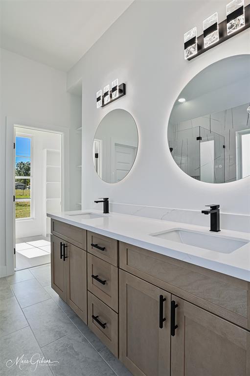 674 Rambin Road Stonewall, LA 71078 - Photo 14 of 26 a spacious bathroom with double vanity and a mirror