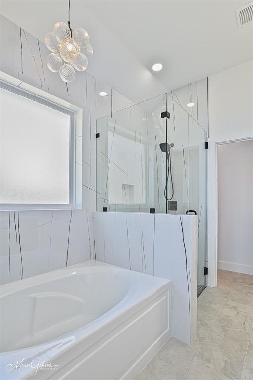 674 Rambin Road Stonewall, LA 71078 - Photo 15 of 26 a bathroom with a bathtub a sink a toilet and a shower