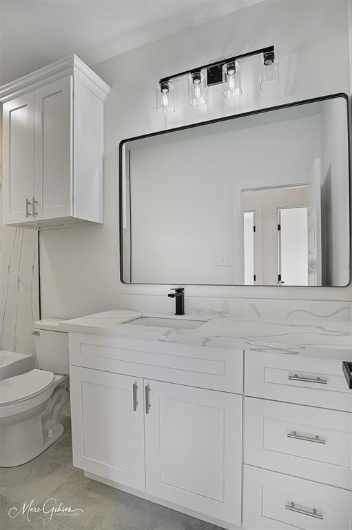 674 Rambin Road Stonewall, LA 71078 - Photo 17 of 26 a bathroom with a sink and a mirror