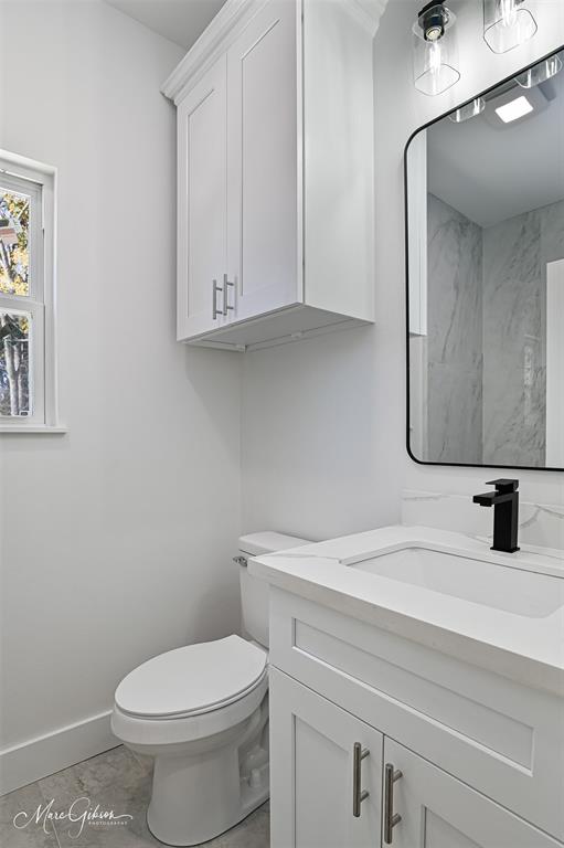 674 Rambin Road Stonewall, LA 71078 - Photo 20 of 26 a bathroom with a toilet sink and mirror