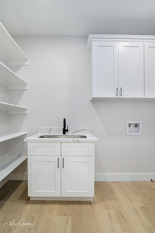 674 Rambin Road Stonewall, LA 71078 - Photo 24 of 26 a view of cabinets with washer and dryer