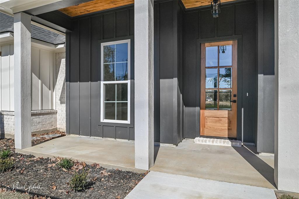 674 Rambin Road Stonewall, LA 71078 - Photo 3 of 26 a view of a door of a house with a porch