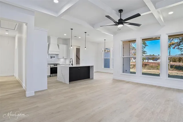 a view of kitchen with stainless steel appliances refrigerator oven and cabinets
