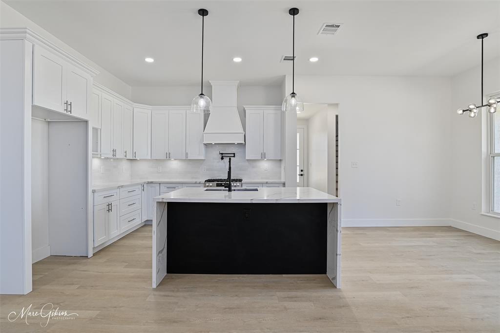 674 Rambin Road Stonewall, LA 71078 - Photo 8 of 26 a view of kitchen with stainless steel appliances granite countertop cabinets and a table