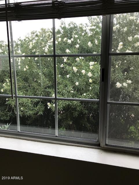 7710 East Gainey Ranch Road, Unit 157 Scottsdale, AZ 85258 - Photo 15 of 16 a view of a glass door