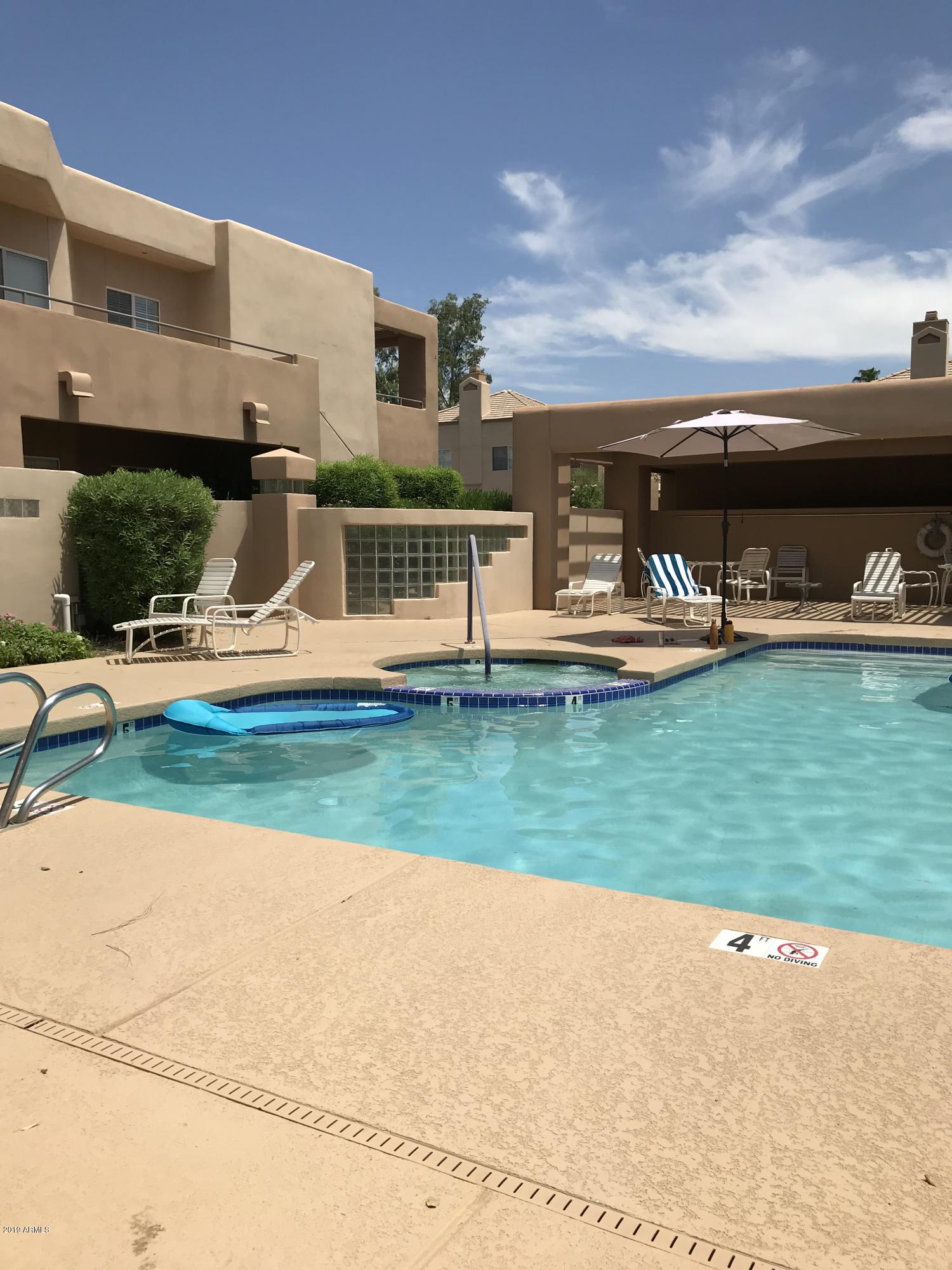 7710 East Gainey Ranch Road, Unit 157 Scottsdale, AZ 85258 - Photo 7 of 16 a view of yard with outdoor seating