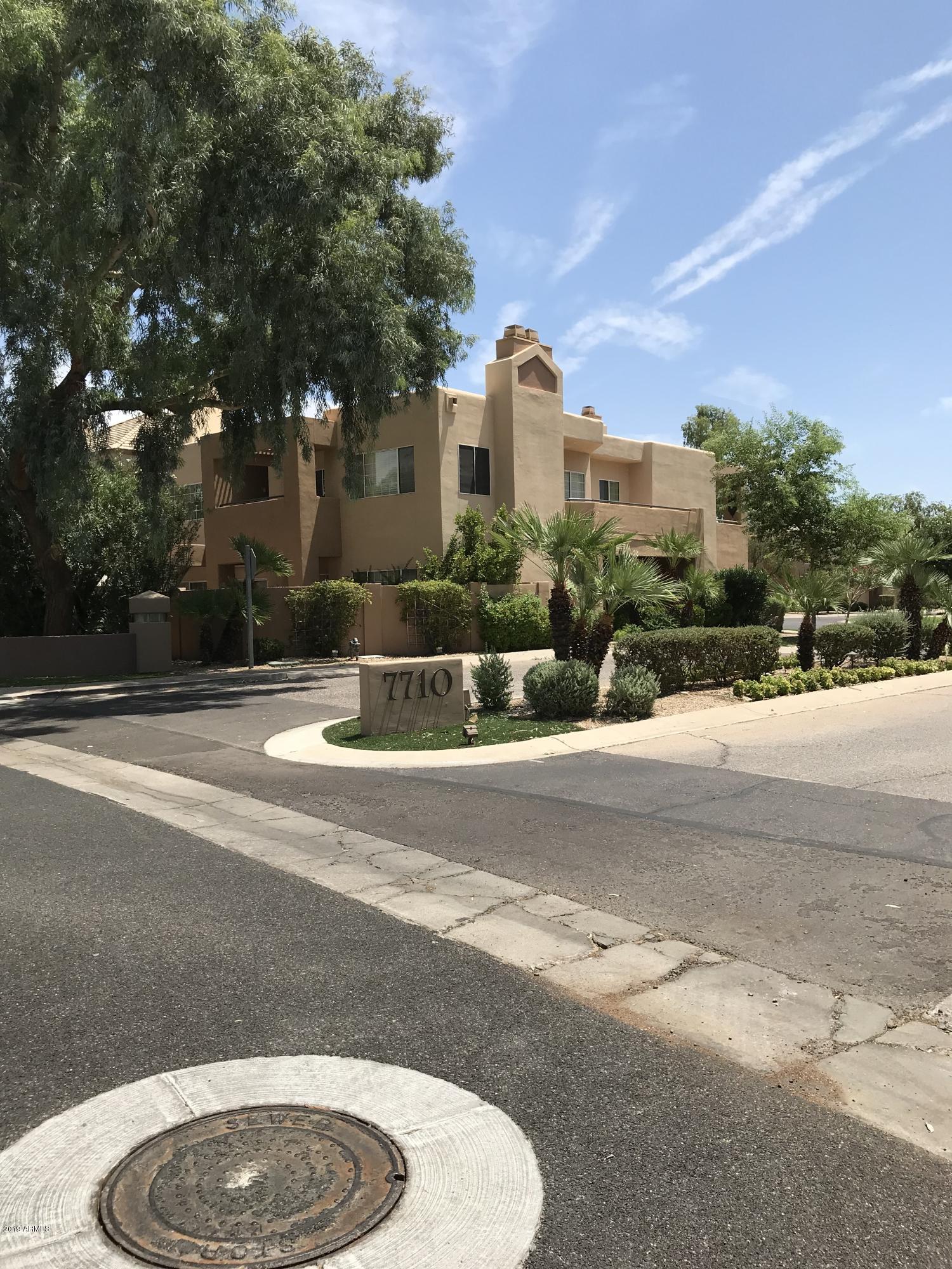 7710 East Gainey Ranch Road, Unit 157 Scottsdale, AZ 85258 - Photo 9 of 16 a view of fountain in front of a house