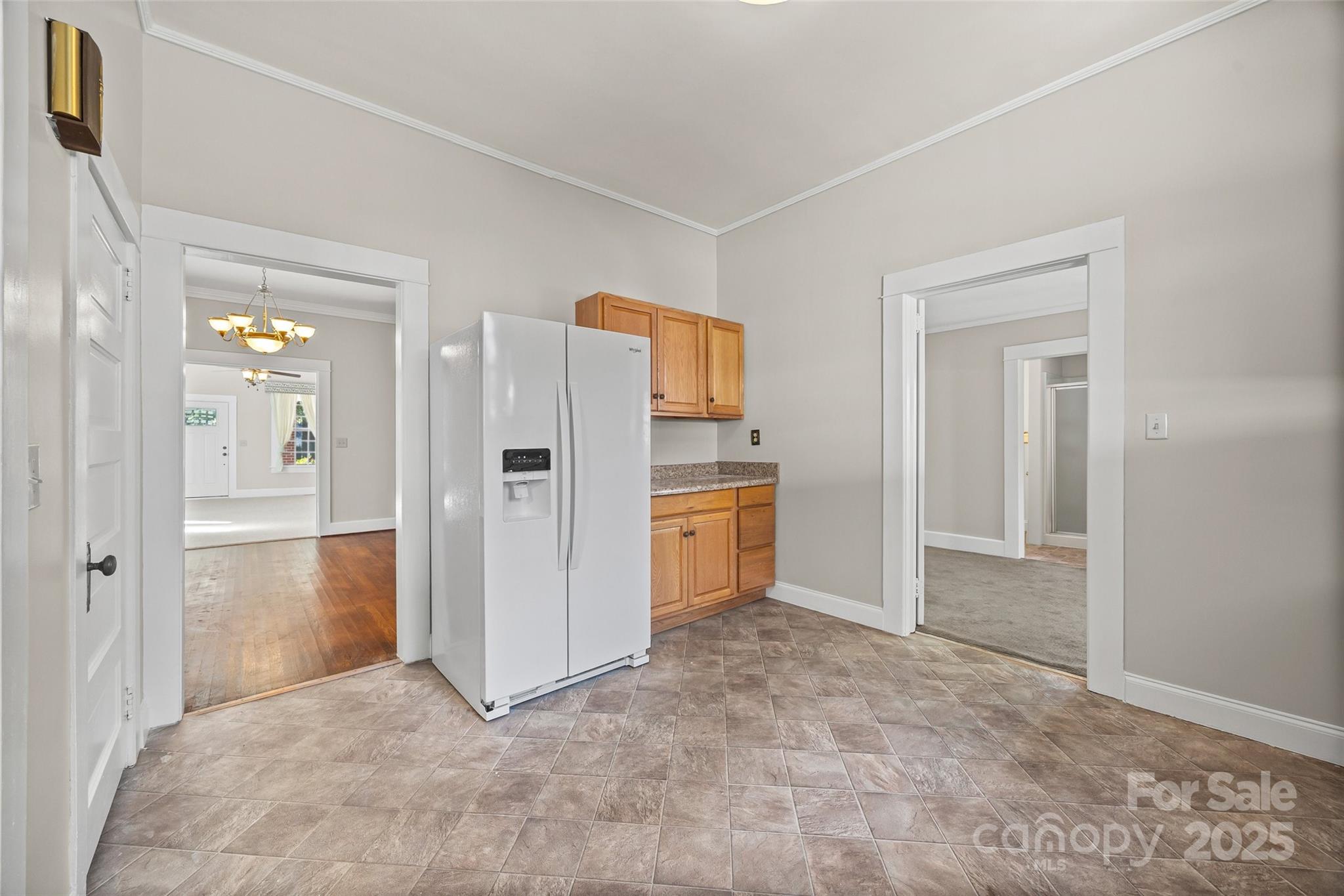 105 Foote Street Chester, SC 29706 - Photo 12 of 28 a view of a kitchen with refrigerator and more cabinets