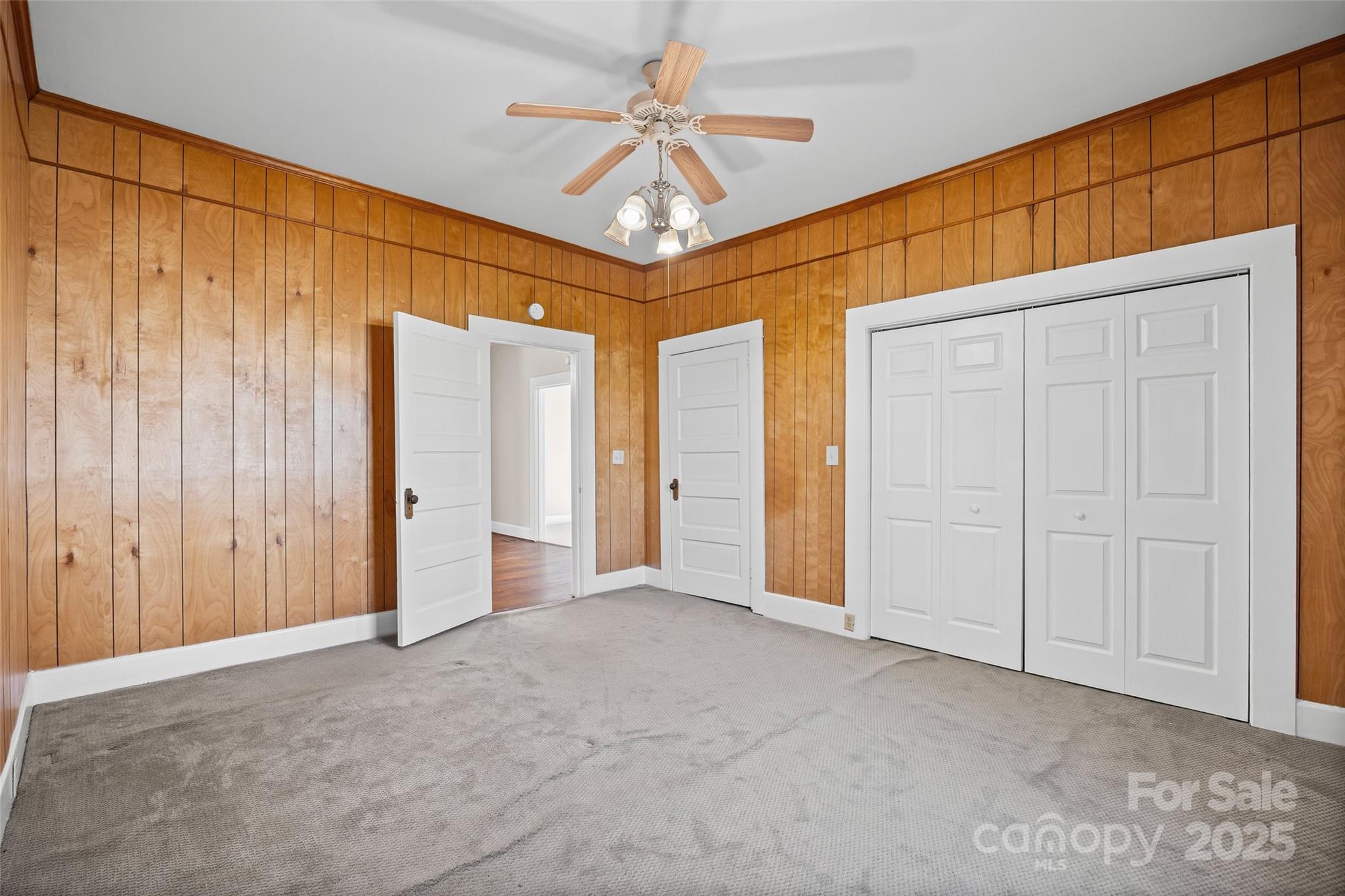 105 Foote Street Chester, SC 29706 - Photo 20 of 28 an empty room with windows and ceiling fan