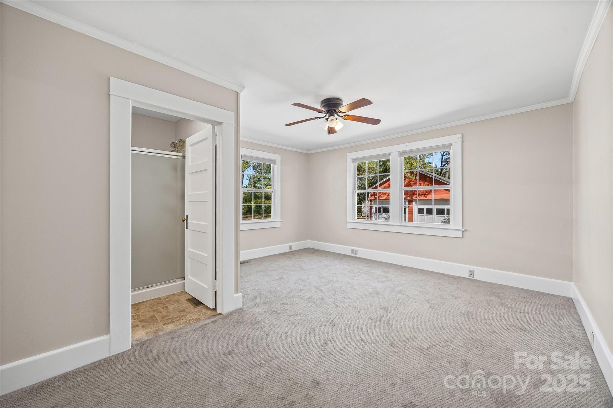 105 Foote Street Chester, SC 29706 - Photo 23 of 28 an empty room with windows and ceiling fan