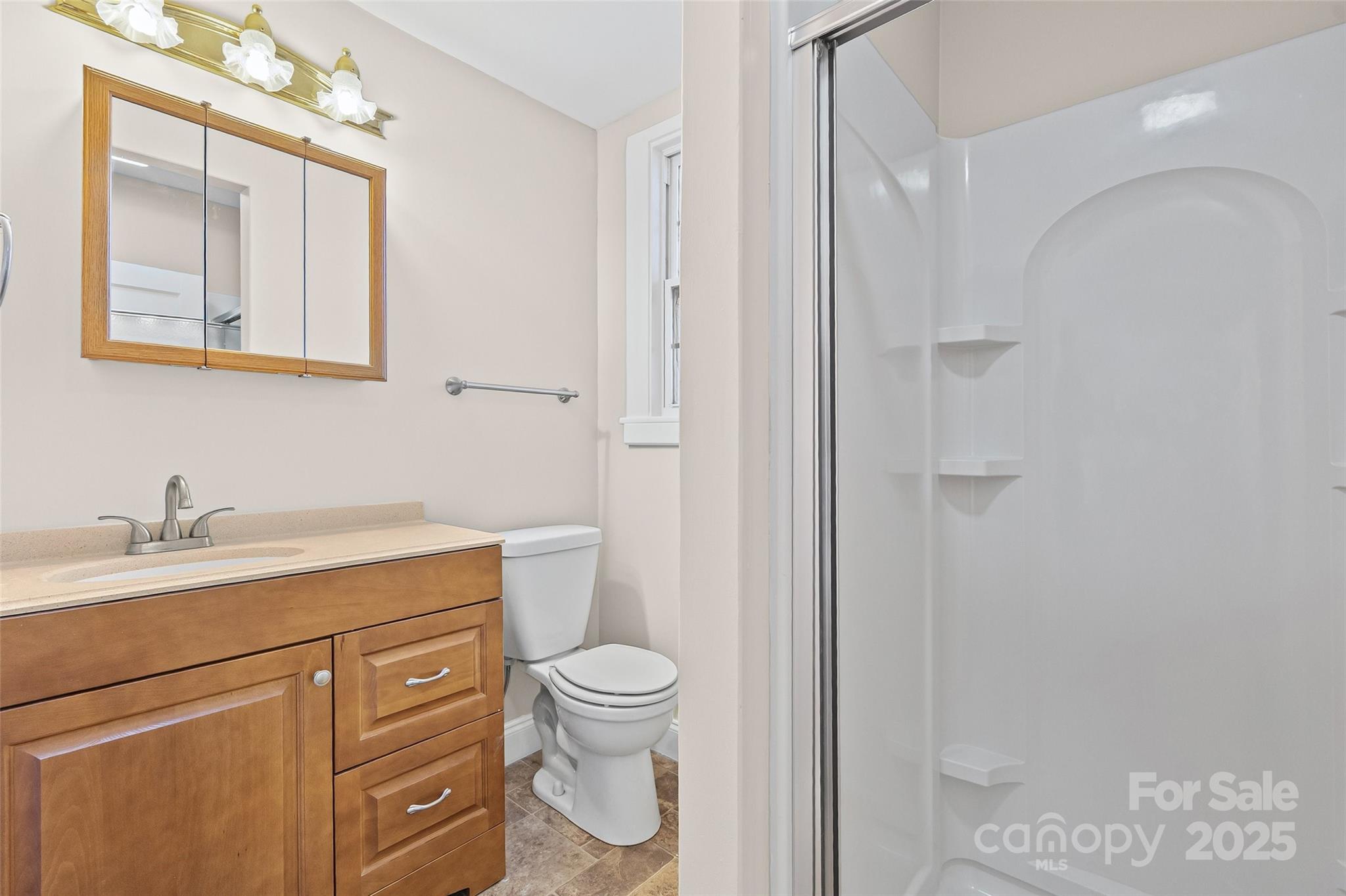 105 Foote Street Chester, SC 29706 - Photo 24 of 28 a bathroom with a granite countertop sink mirror vanity and toilet