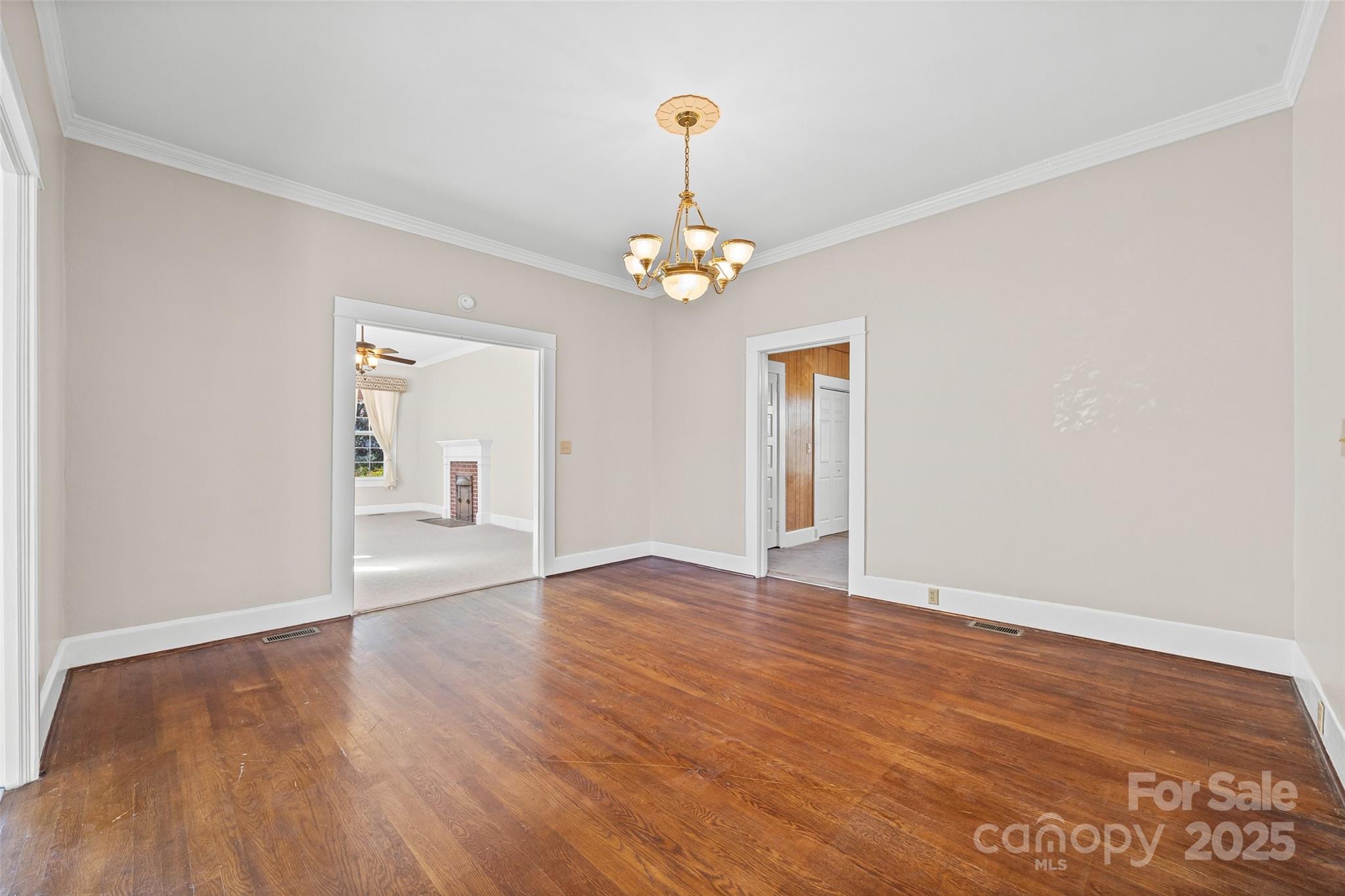 105 Foote Street Chester, SC 29706 - Photo 9 of 28 a view of empty room with wooden floor and fan