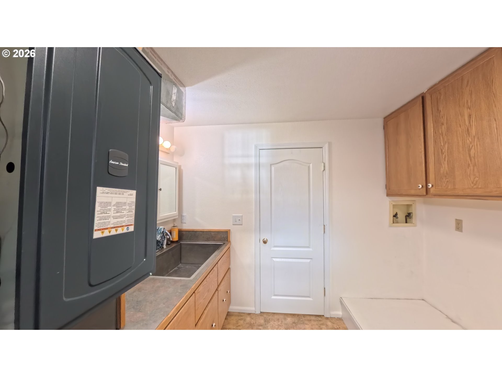 1732 Del Rio Road Roseburg, OR 97471 - Photo 21 of 39 a open kitchen with a sink and cabinets