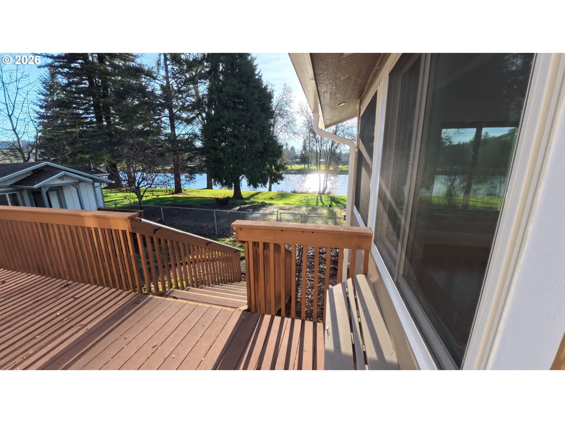 1732 Del Rio Road Roseburg, OR 97471 - Photo 24 of 39 a balcony with wooden floor and outdoor seating