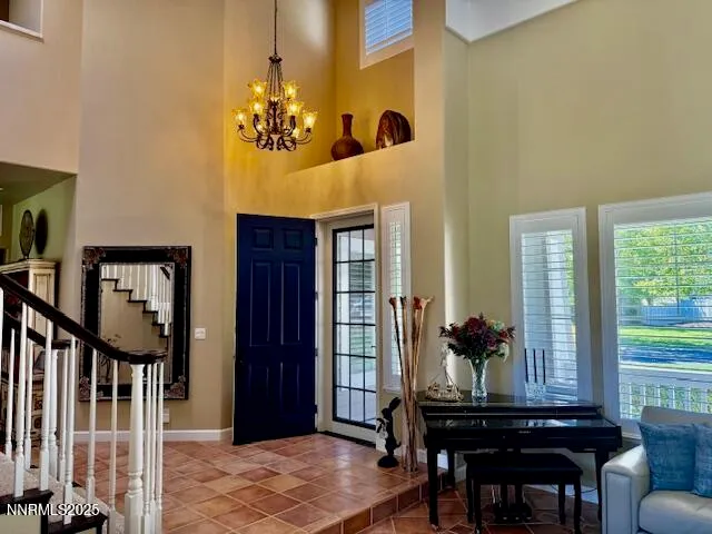 a view of a dining room with furniture and window