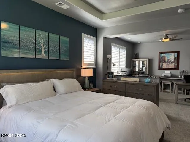 a bedroom with a large bed and a large window